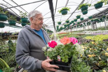 man holding flowers
